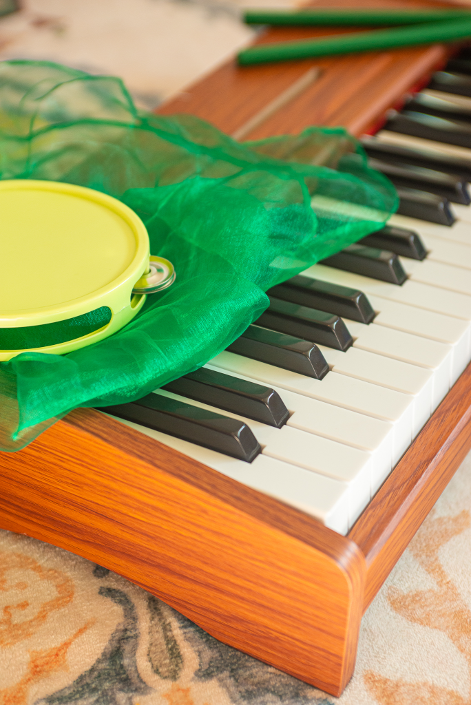child piano with tambourine