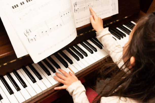 Girl playing piano in Fairview Park